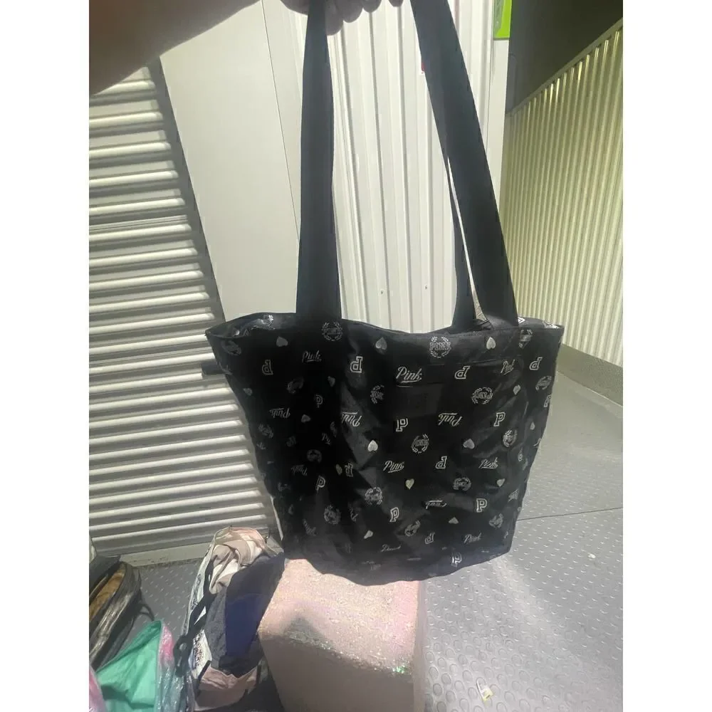 Vintage multi logo black weekender tote bag vs pink